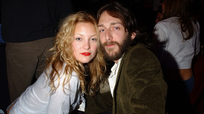 Kate Hudson and Chris Robinson posing cheek to cheek for the camera