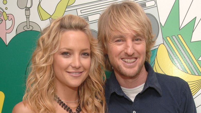 Kate Hudson and Owen Wilson smiling and posing