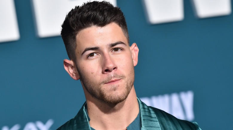Nick Jonas in closeup at the 'Midway' premiere in 2019