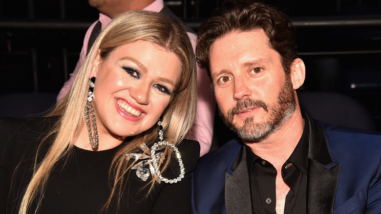 Kelly Clarkson and Brandon Blackstock posing together