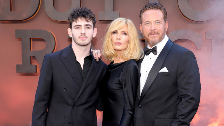 Finn Little, Kelly Reilly, and Cole Hauser posing together at a premiere