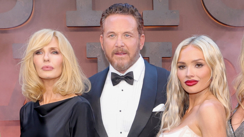Kelly Reilly, Cole Hauser, and Natalie Alyn Lind posing together at a premiere