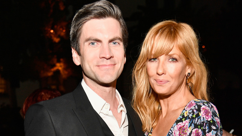 Wes Bentley and Kelly Reilly posing together at an event