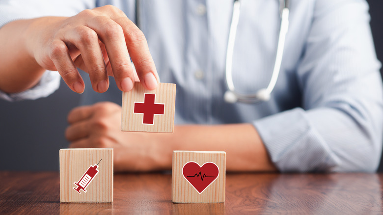 A doctor with blocks annotating health