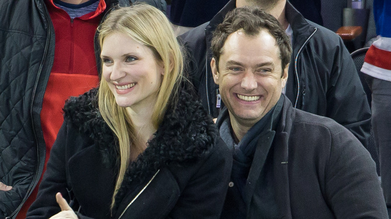 Phillipa Coan and Jude Law smiling at an event