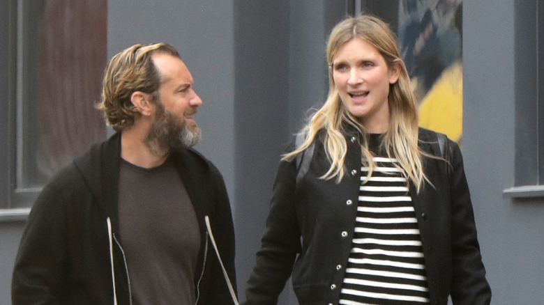 Jude Law and Phillipa Coan walking outside