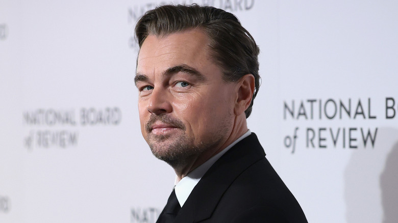 Leonardo DiCaprio posing in a black suit at the 2026 National Board of Review Awards