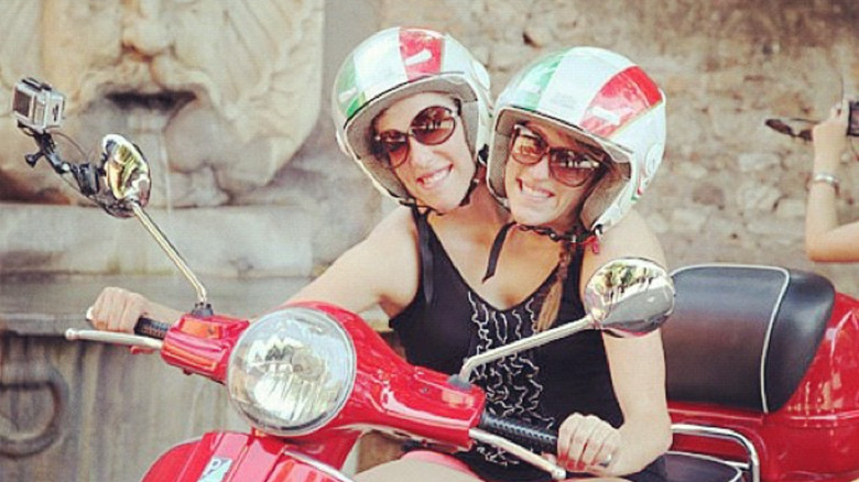 Abby and Brittany driving a motorcycle