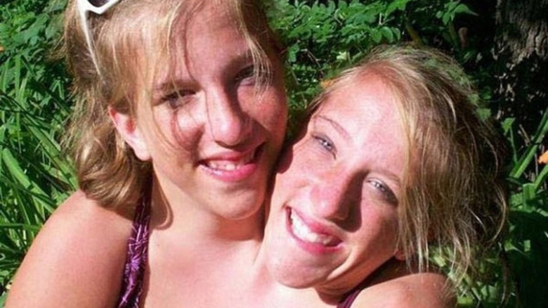 Abby and Brittany Hensel smiling outside