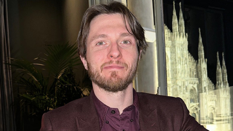 Closeup of Raffaele Sollecito smiling in a restaurant