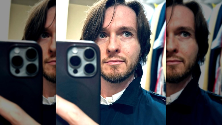 Raffaele Sollecito taking a selfie in a mirror
