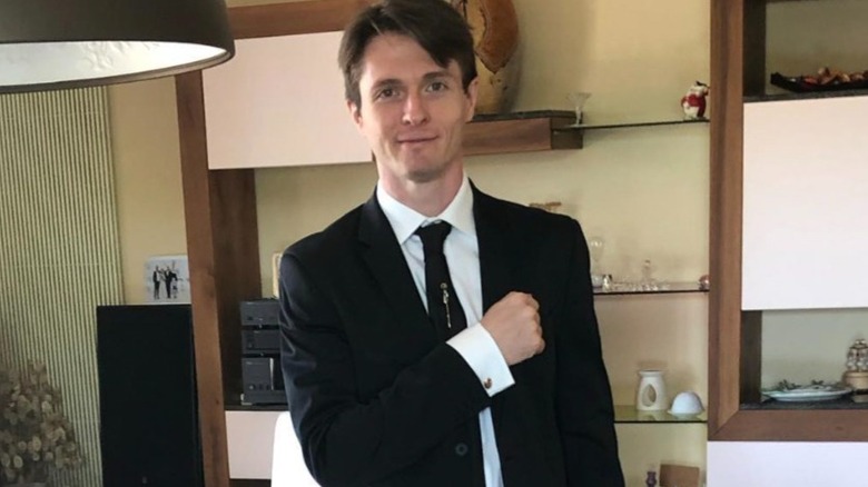 Raffaele Sollecito posing in a suit