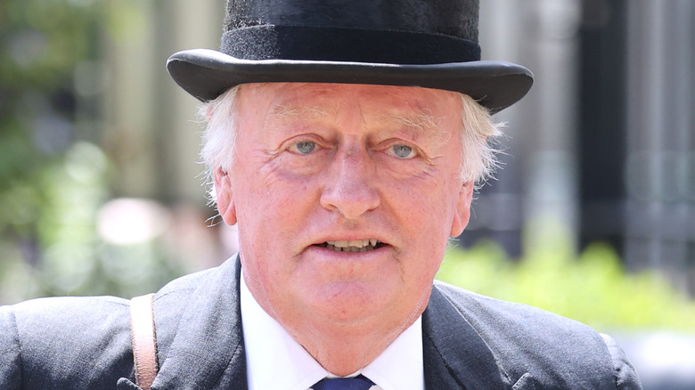Andrew Parker Bowles in black hat
