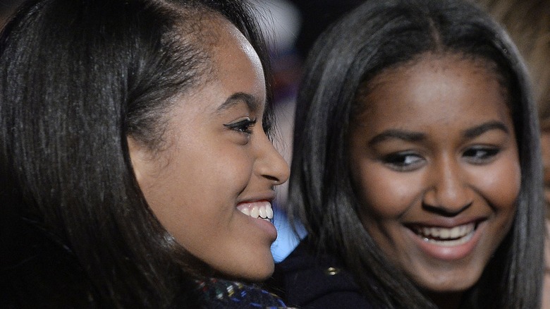 Malia Obama and Sasha Obama smiling
