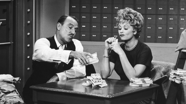 Gale Gordon and Lucille Ball counting money on "The Lucy Show"