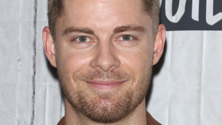 Luke Mitchell smiling at an event