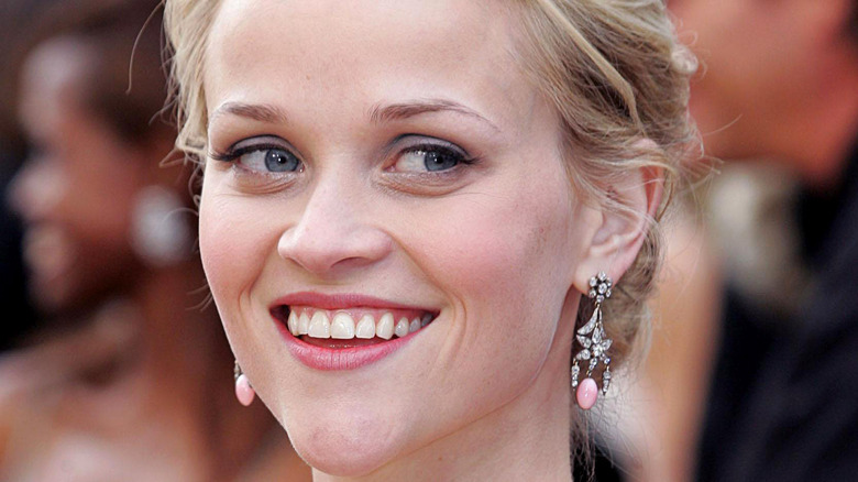 Reese Witherspoon poses on a red carpet