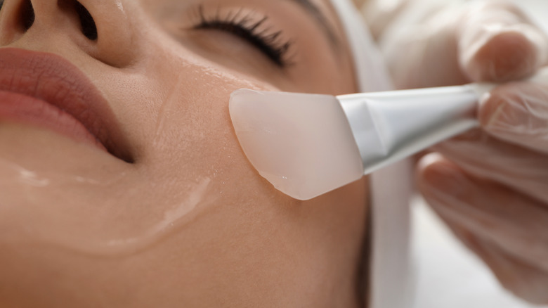 Woman getting chemical peel