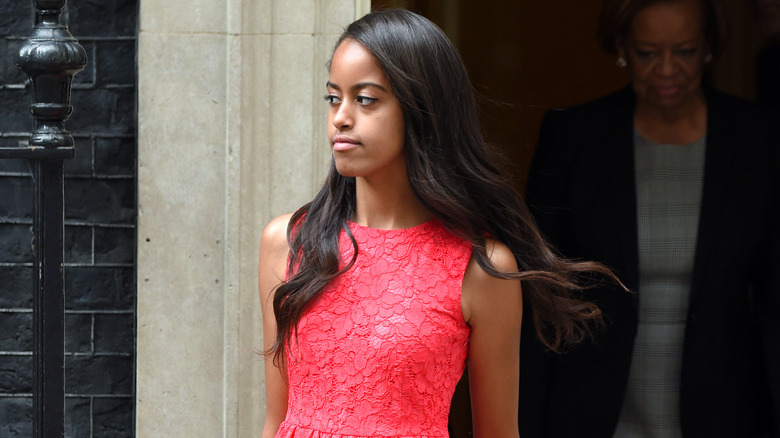 Malia Obama walking in red dress