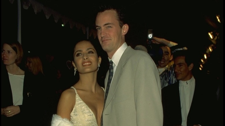 Matthew Perry and Salma Hayek smiling on red carpet