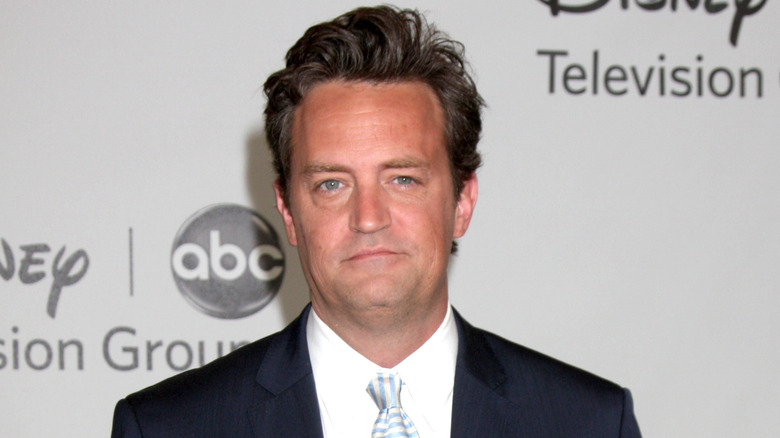 Matthew Perry with a half smile