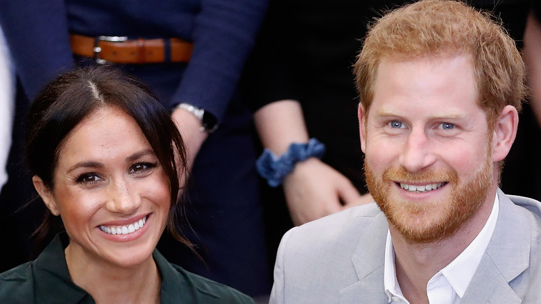 Prince Harry and Meghan Markle smiling