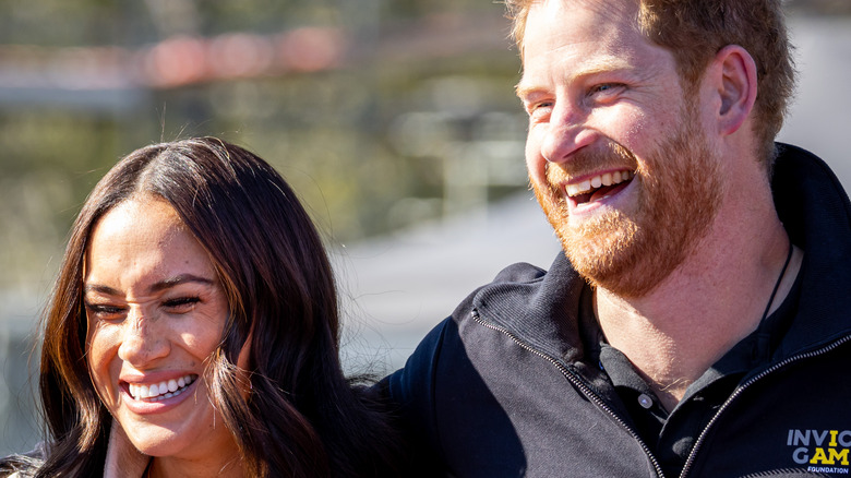 Prince Harry & Meghan Markle smiling 