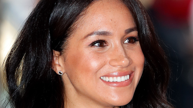 Meghan Markle smiling at an event