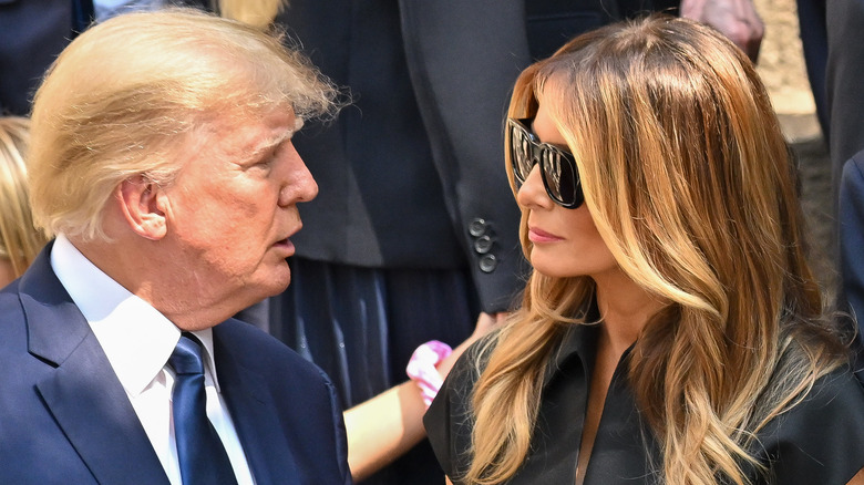 Donald Trump and Melania Trump looking at each other