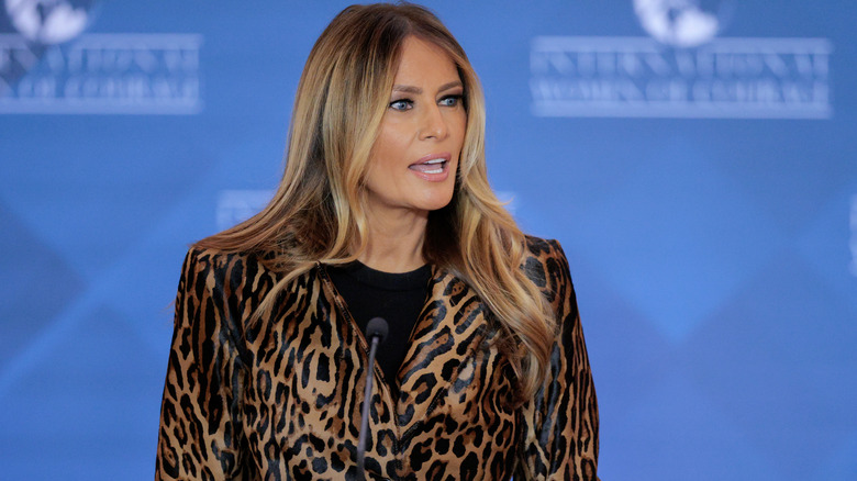 Melania Trump giving a speech in a leopard print blazer