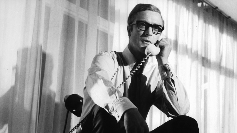 Michael Caine as Harry Palmer in "Funeral in Berlin" talking on the phone