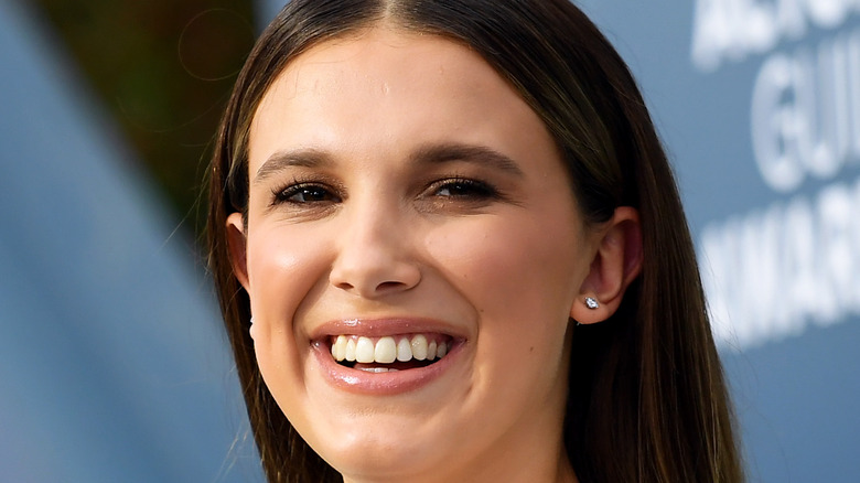 Millie Bobby Brown laughs on the red carpet