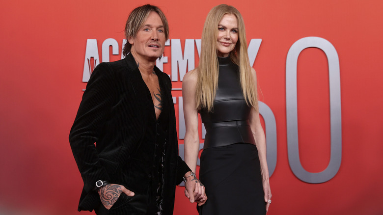 Keith Urban and Nicole Kidman posing at an event together wearing all black