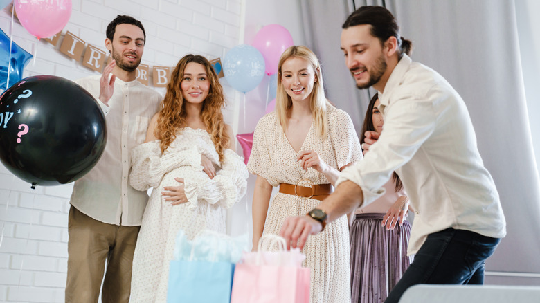 young adults at a gender reveal party