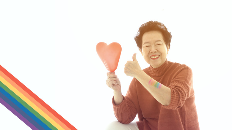 Asian woman rainbow on arm