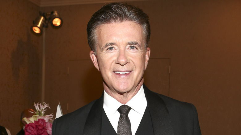 Alan Thicke wearing a suit and tie