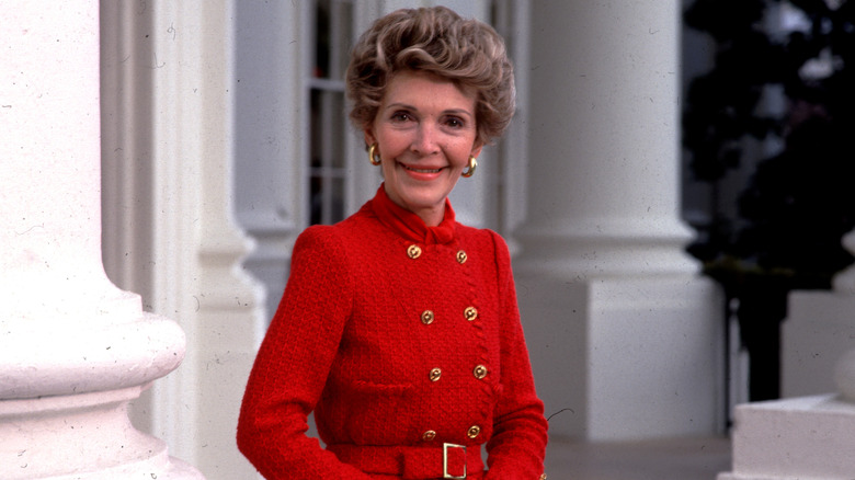Nancy Reagan wearing a red and gold outfit