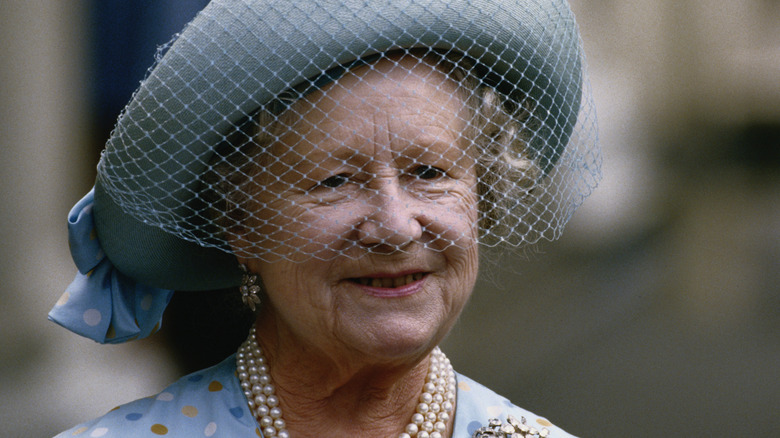 Elizabeth, the Queen Mother wearing a veiled hat circa 1990