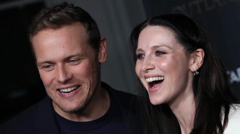 Sam Heughan and Caitriona Balfe laughing