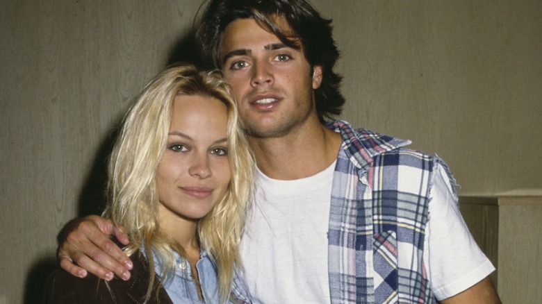 David Charvet with his arm around Pamela Anderson's shoulder.