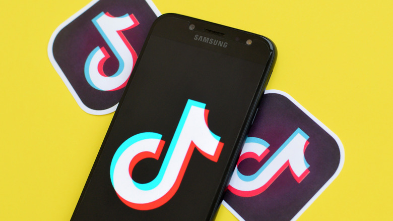 TikTok logo on yellow background