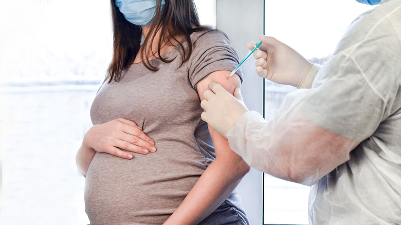 Pregnant woman getting vaccinated