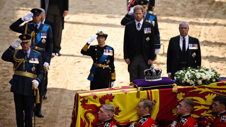 The royal procession for the queen saluting her