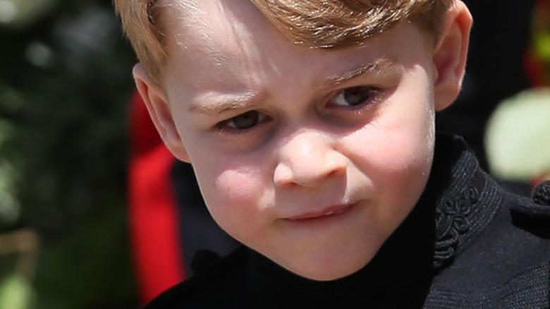 Prince George walking outside