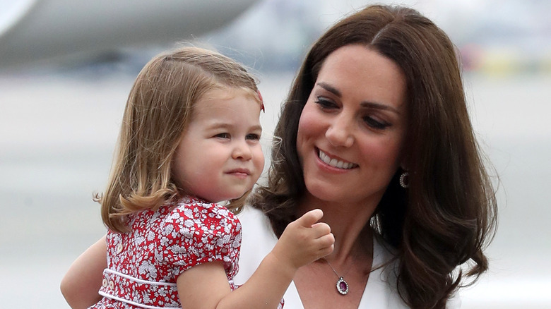 Princess Catherine holding Princess Charlotte