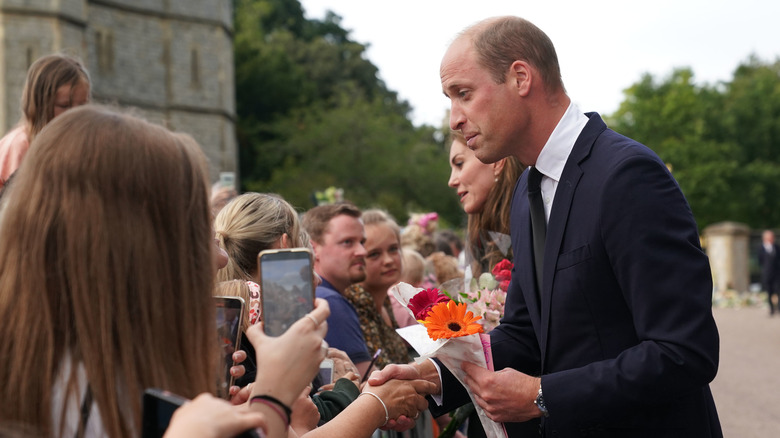 Prince William speaking to well-wishers