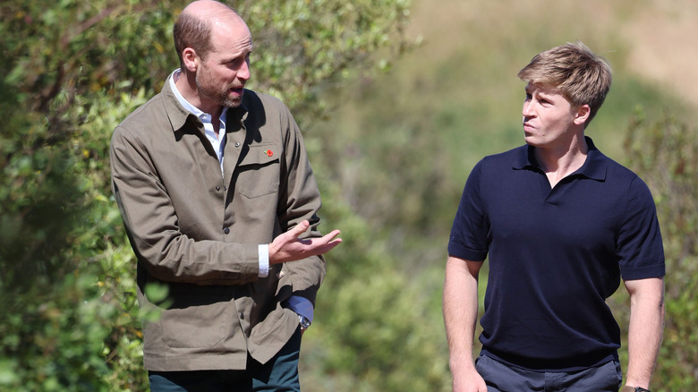 Prince William and Robert Irwin chatting while taking a walk in nature