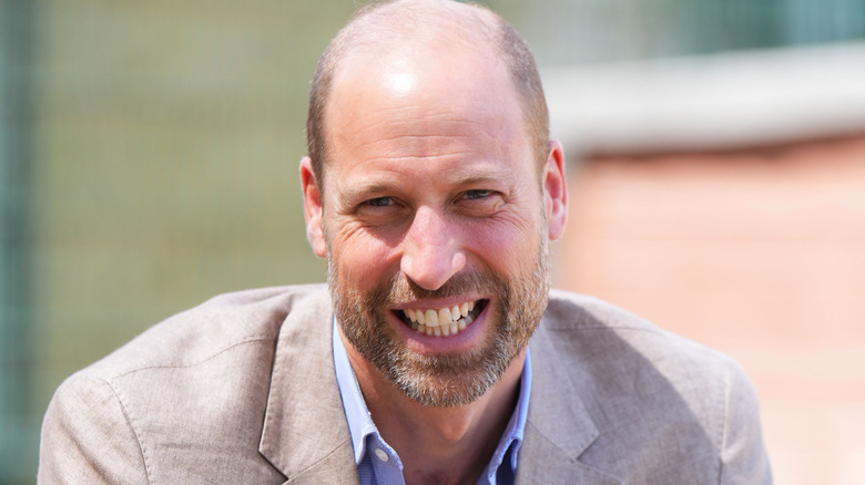 Prince William smiling at the camera