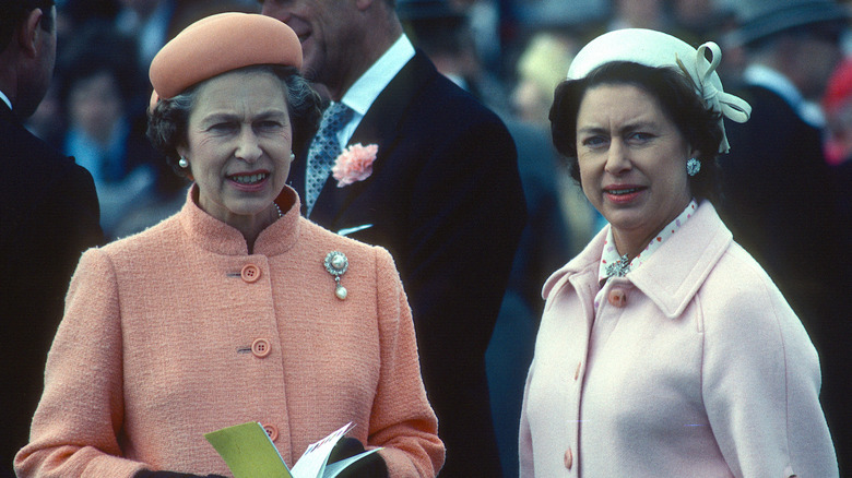 Queen Elizabeth and Princess Margaret at event