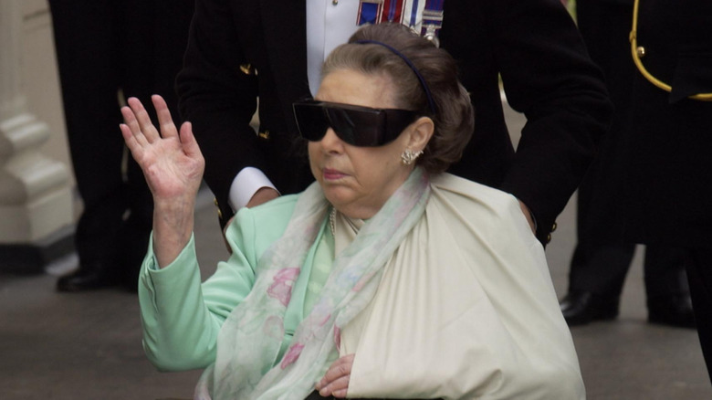 Princess Margaret in a wheelchair wearing sunglasses